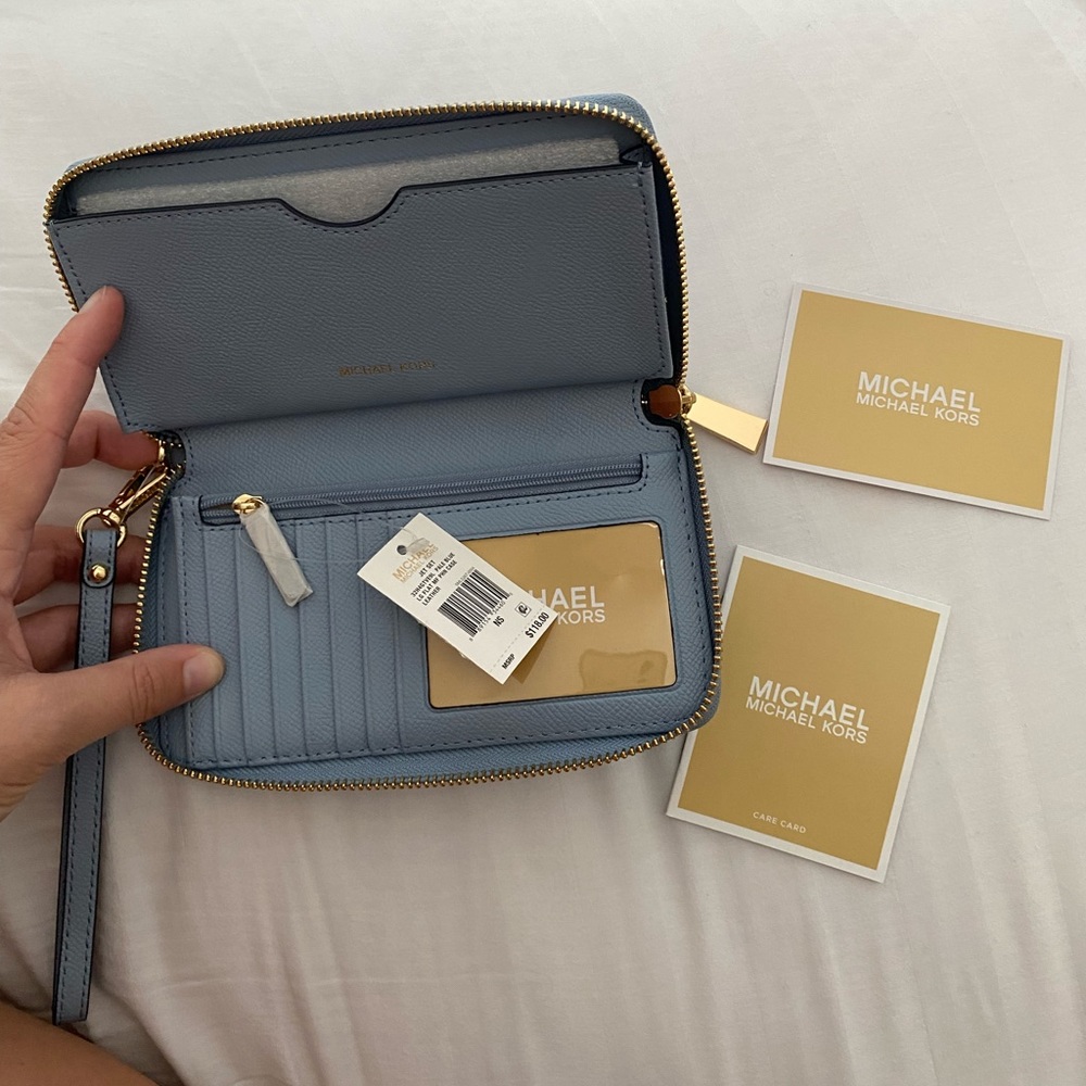 Brand new with tags never used Michael Kors, baby blue wristlet wallet